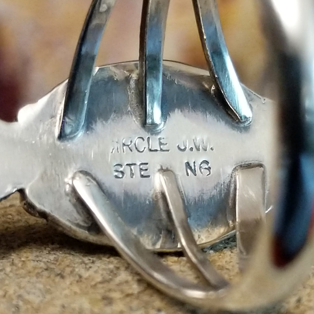 The authentication stamp is found on the underside of the bezel.