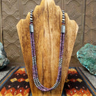 Features purple spiny oyster shell heishi beads with orange matrixes.