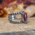 Open, layered sterling silver band with stamping and a purple spiny oyster centerpiece.