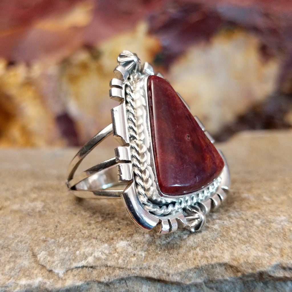 Intricate ridged accents on the silver setting with a purple spiny oyster shell set in it.