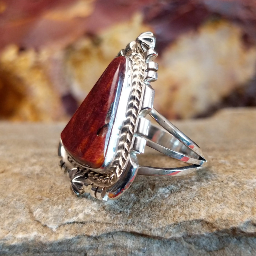 Intricate ridged accents on the silver setting with a purple spiny oyster shell set in it.