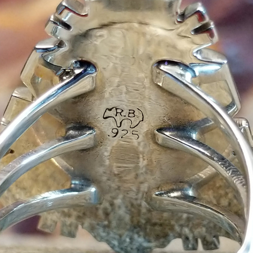 The stamp is found on the inside of the setting.