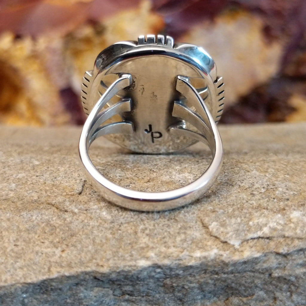 Thin polished sterling silver band of the ring.