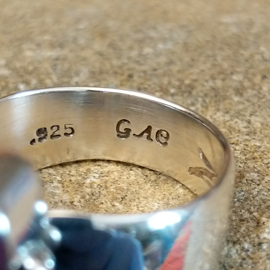 The stamps are found on the inside of the ring.