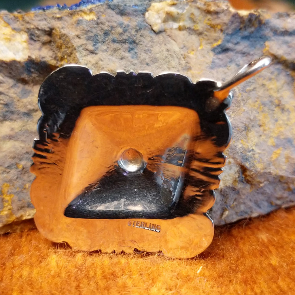 The authentication is stamped on the back.