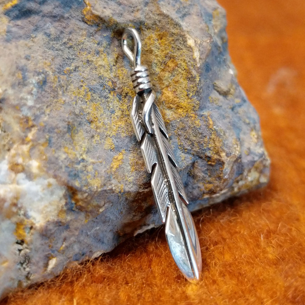Straight sterling silver feather pendant.