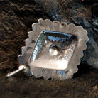 The back features the authentication stamp.