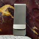 Smooth stainless steel backing of the clip.