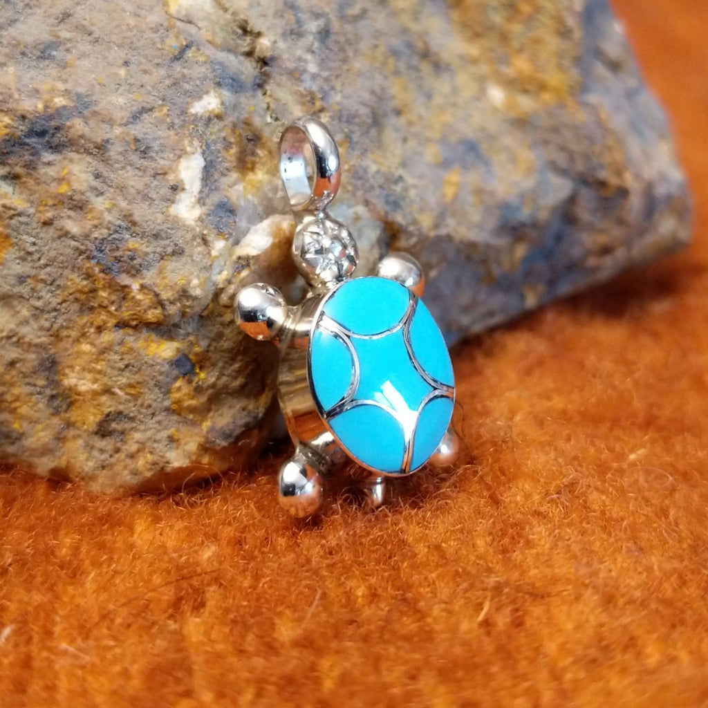 Turquoise inlaid in sterling silver turtle pendant.