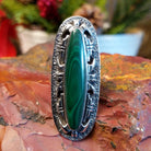 Tufa cast sterling silver ring with large malachite stone set in the bezel.