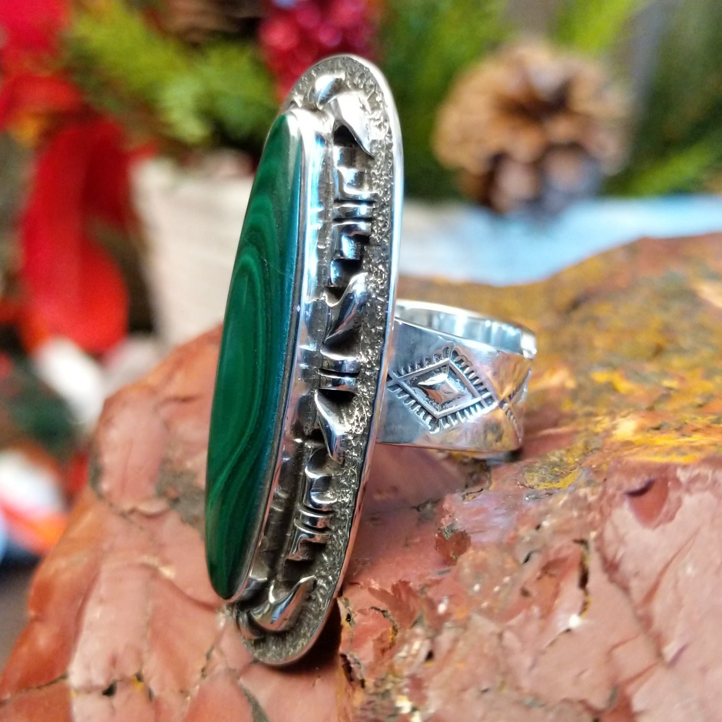 Tufa cast sterling silver ring with large malachite stone set in the bezel.