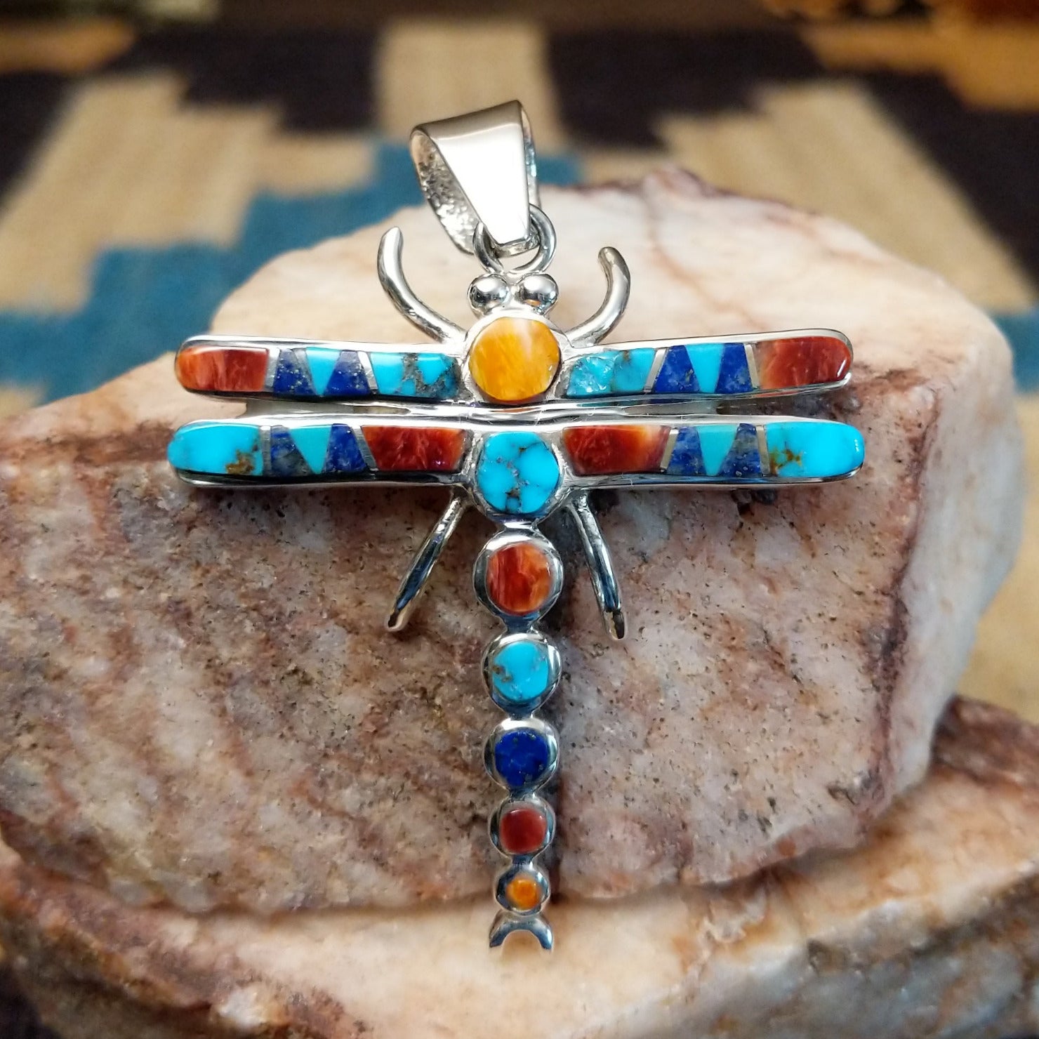 Sterling silver dragonfly pendant with multistone inlay.