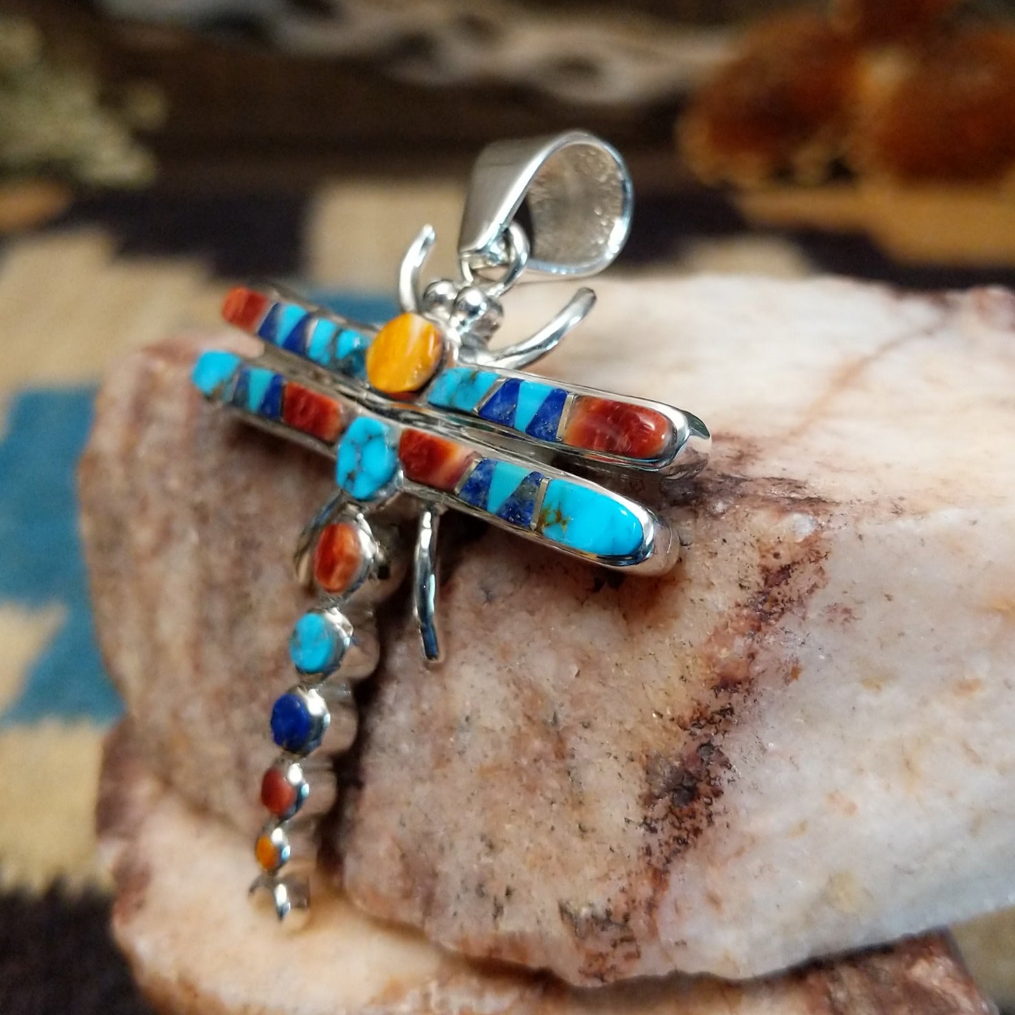 Sterling silver dragonfly pendant with multistone inlay.