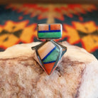 Sterling silver ring with multi-stone inlays set in the geometric bezels.