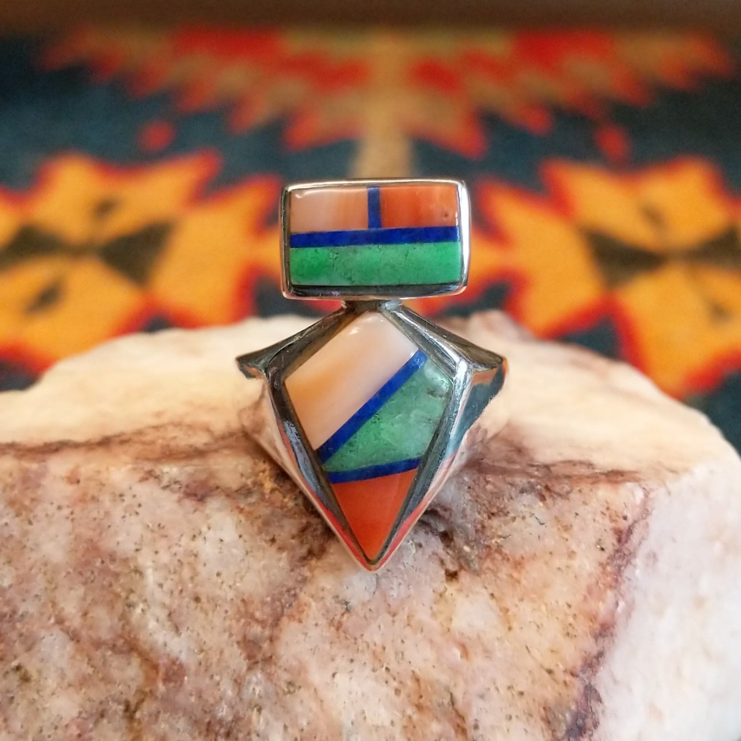 Sterling silver ring with multi-stone inlays set in the geometric bezels.