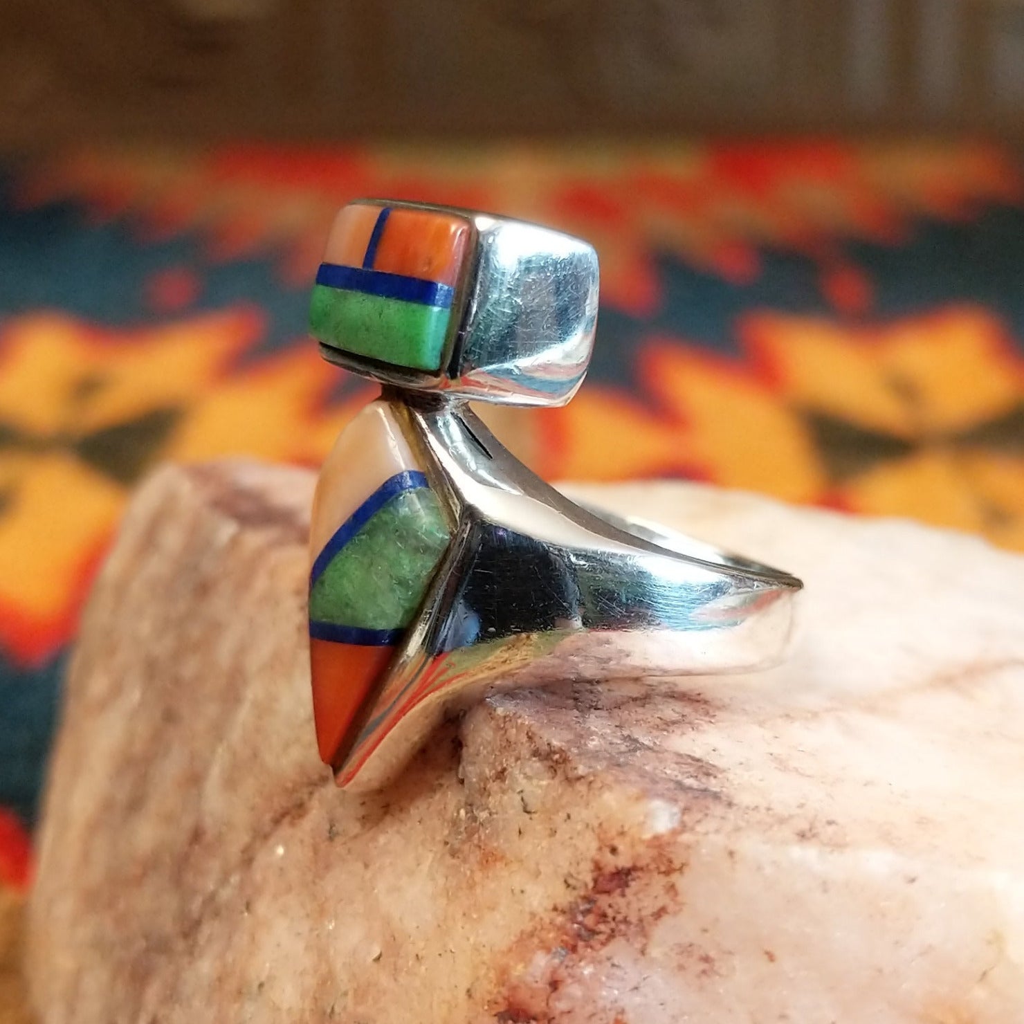 Sterling silver ring with multi-stone inlays set in the geometric bezels.