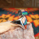 Sterling silver ring with multi-stone inlays set in the geometric bezels.