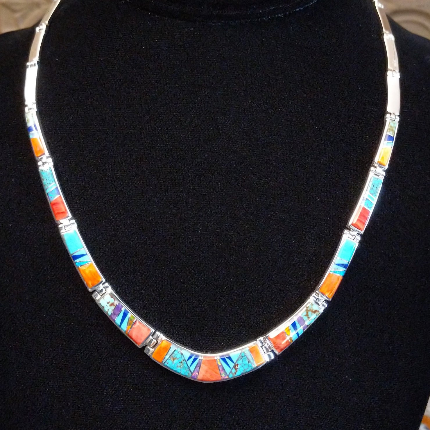 Sterling silver necklace and earring set with orange and red spiny oyster shell, turquoise, lapis, charoite, and manmade opal inlaid.