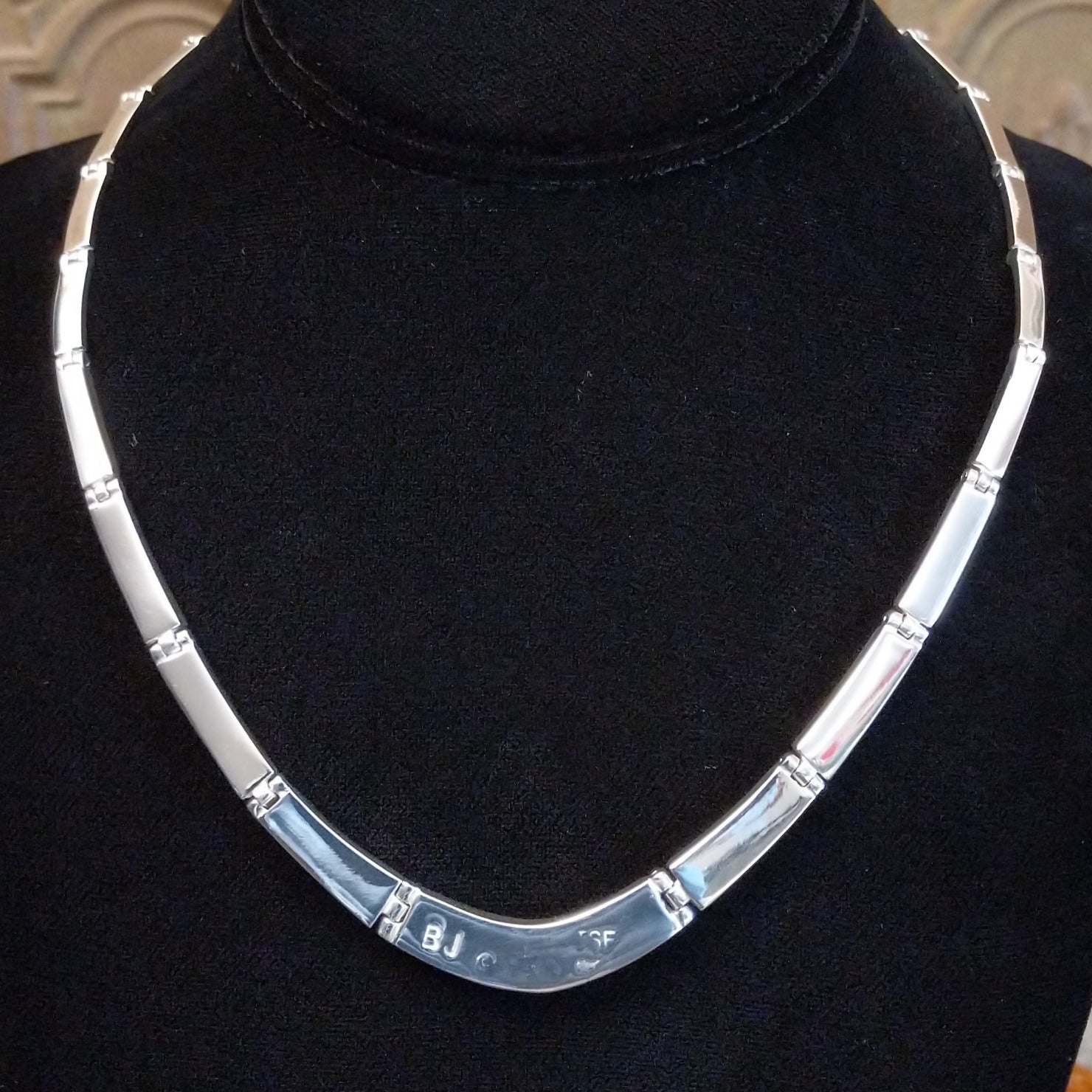The back of the necklace showcases the link chain and polished sterling silver.