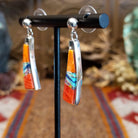 Sterling silver earrings with orange and red spiny oyster shell, turquoise, lapis, charoite, and manmade opal inlaid.