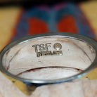 Navajo multistone inlay ring, featuring a colorful arrangement of natural stones set in a handcrafted sterling silver band with traditional Southwestern-inspired craftsmanship.  Artisan and Sterling Silver stamp.