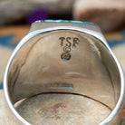 Sterling silver Navajo multistone inlay ring featuring turquoise, orange spiny oyster shell, lapis, and geometric mosaic inlay on a polished signet-style band; artisan and Sterling Silver stamp.