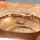 Navajo Multistone Inlay Ring by R.L. featuring geometric turquoise, lapis, and orange and red-toned spiney oyster shell inlay separated by Sterling Silver channels on a polished silver band; artisan stamp.
