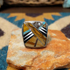 Handcrafted Navajo sterling silver ring by B.J. featuring a bold geometric inlay design in a polished silver setting with a contemporary Southwestern style.
