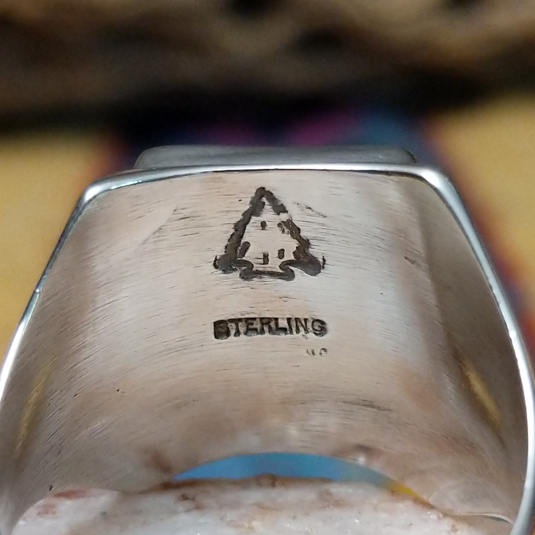 Navajo multistone mosaic ring, featuring a colorful mosaic of natural stones set in a handcrafted sterling silver band with traditional Southwestern-inspired craftsmanship.  Artisan and Sterling Silver stamp.