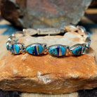 Navajo multistone inlay bracelet by V.J. with turquoise, lapis, and Mother of Pearl teardrop links in sterling silver.