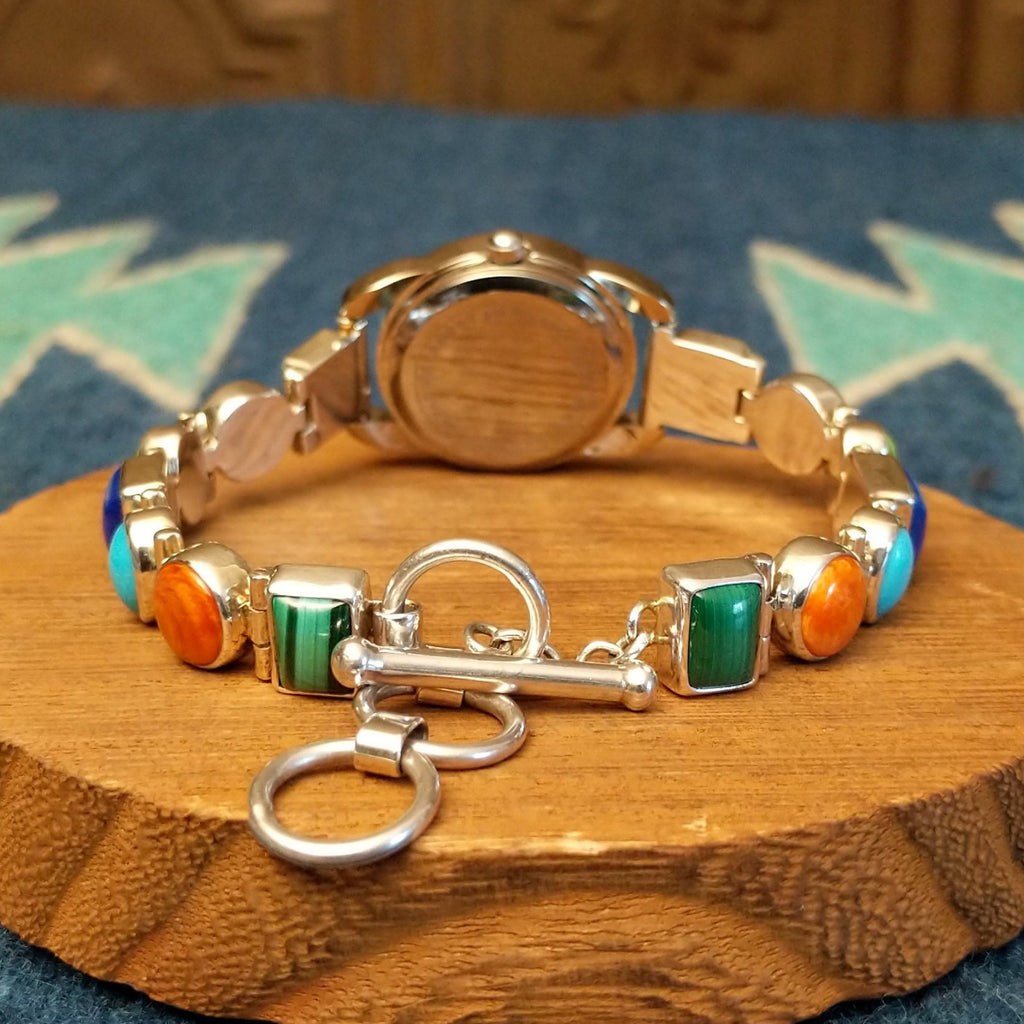 Vibrant, multistone watch linked together with a semi-adjustable clasp.