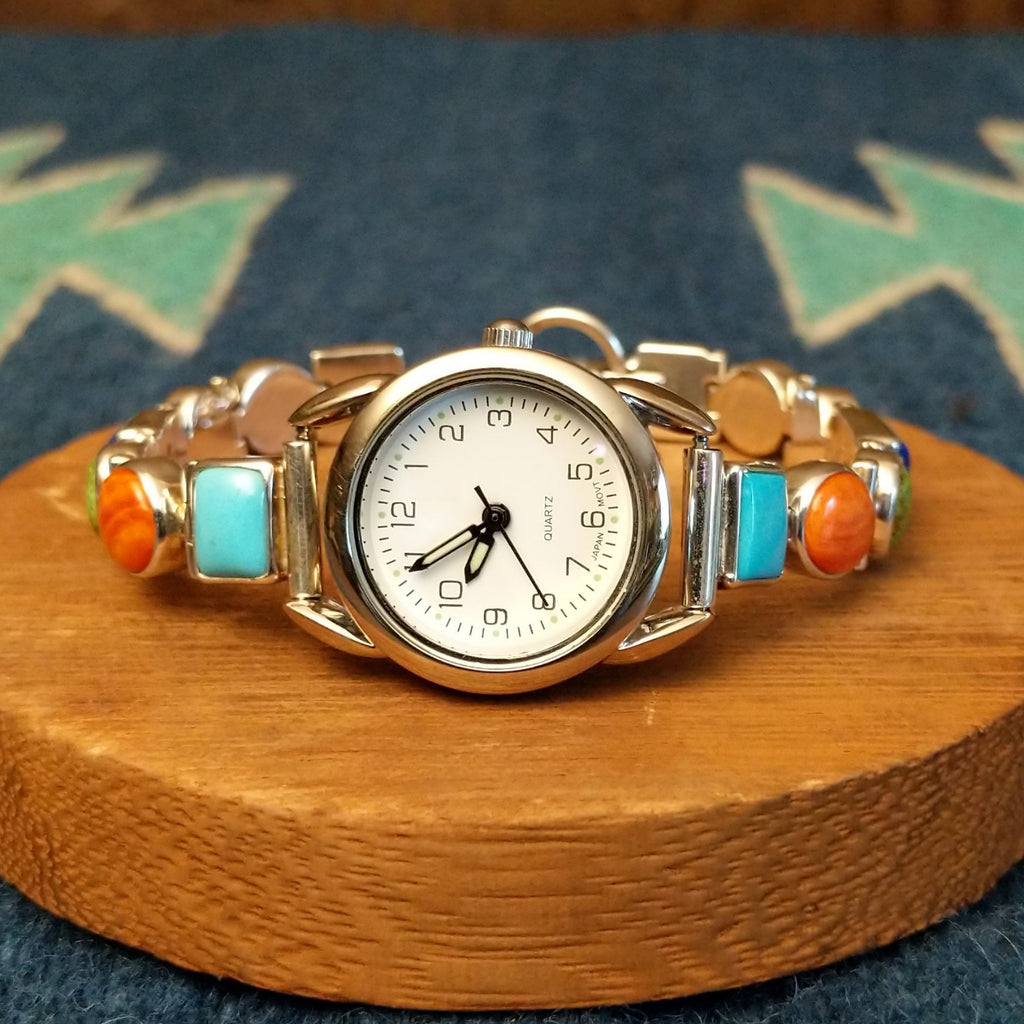 Vibrant, multistone watch linked together with a semi-adjustable clasp.