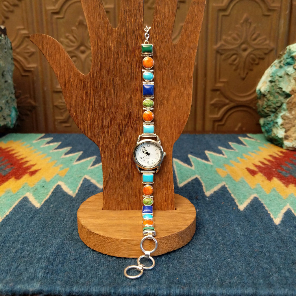 Vibrant, multistone watch linked together with a semi-adjustable clasp.