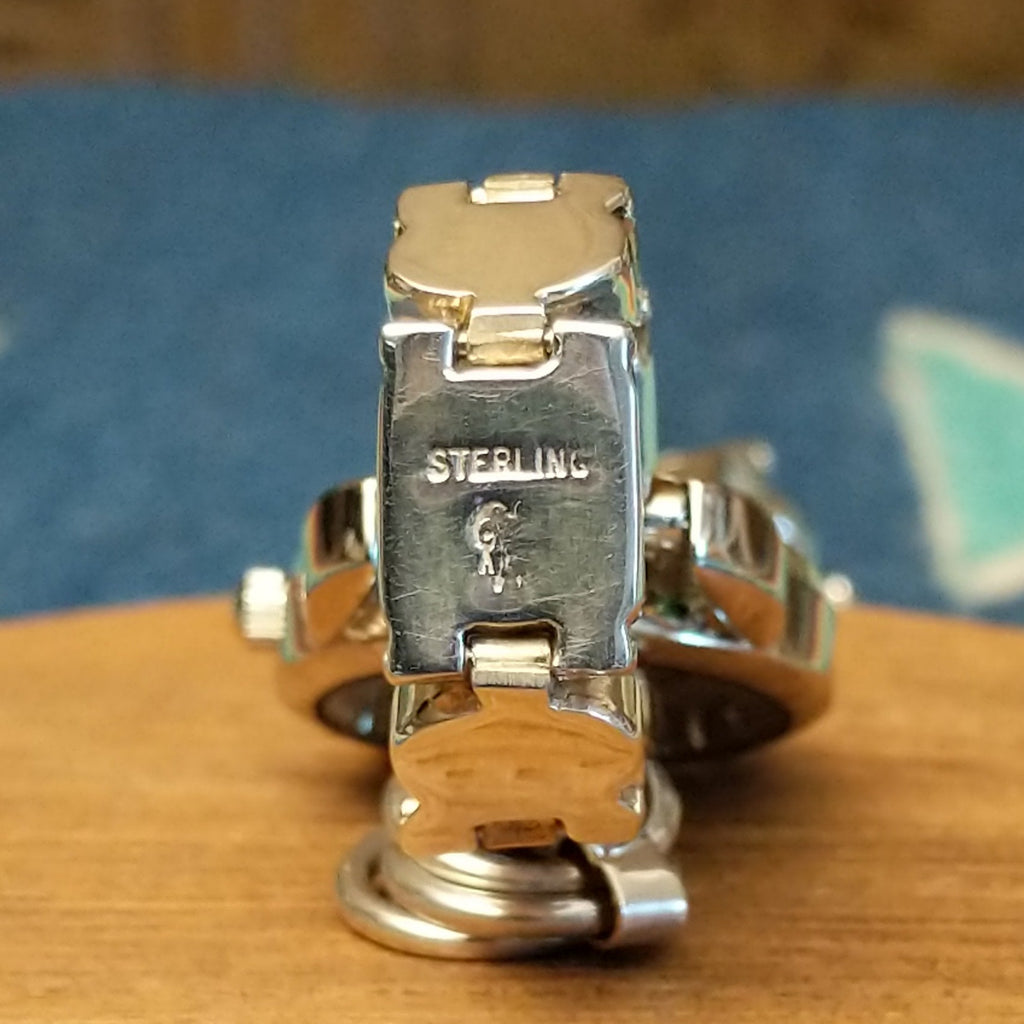 The stamp is found on the underside of the bezels.