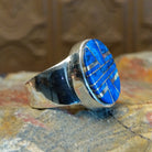Sterling silver ring with round bezel and inlaid lapis.