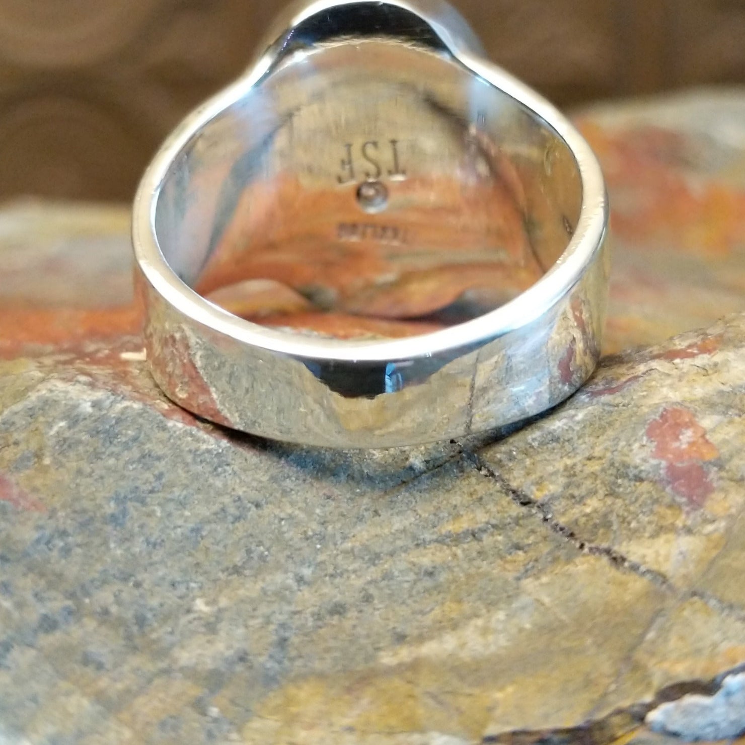 Sterling silver ring with round bezel and inlaid lapis.