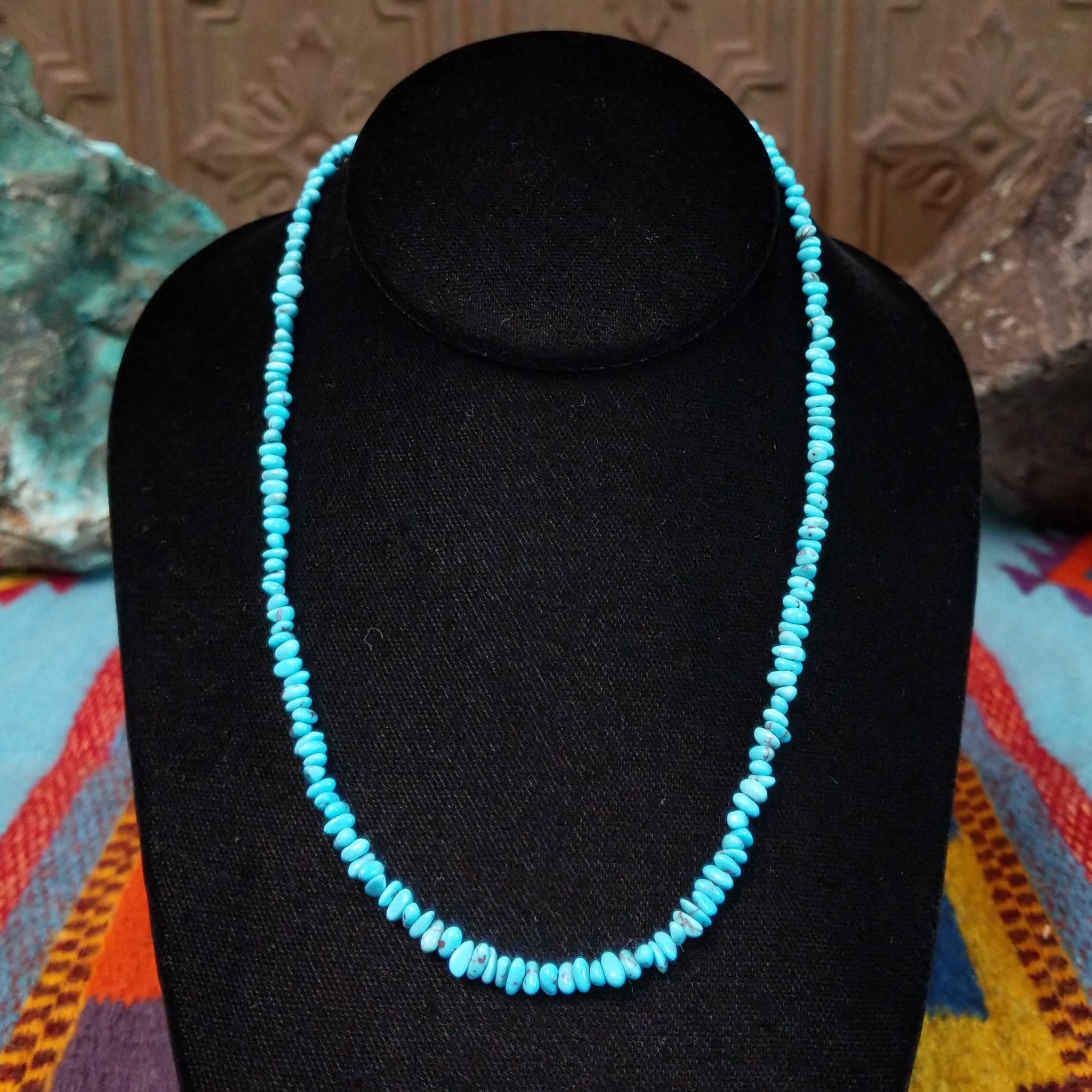 Long single-strand necklace of small, irregular blue-green turquoise nugget beads