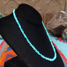 Long single-strand necklace of small, irregular blue-green turquoise nugget beads