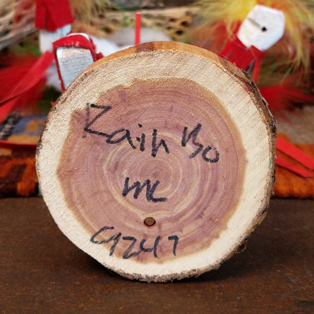 The underside of the base features the title of the piece and artisan's initials.