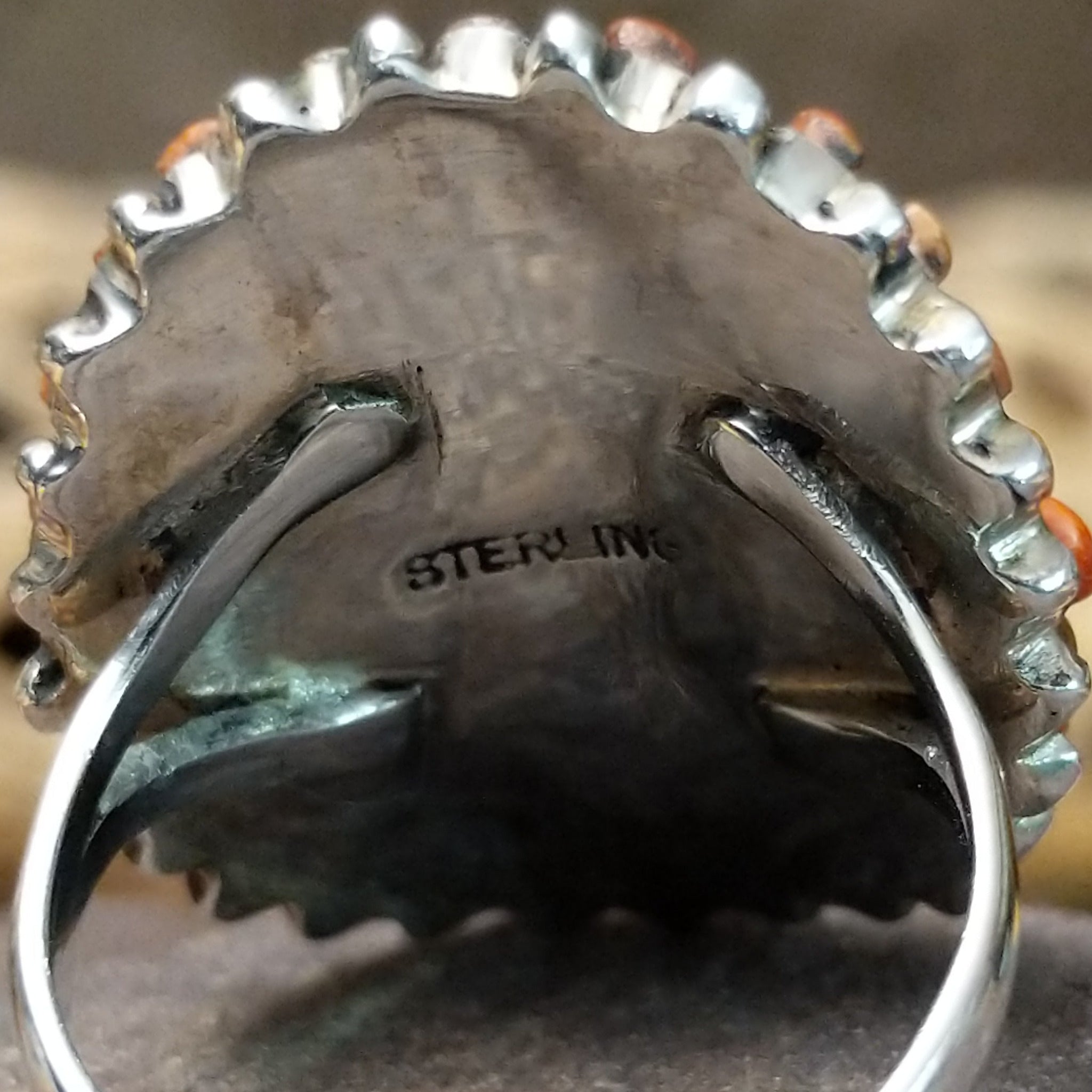 Navajo red spiny oyster shell concho ring, featuring a vibrant red spiny oyster shell set in a handcrafted sterling silver concho-style band with traditional Southwestern details.  Sterling Silver stamp.