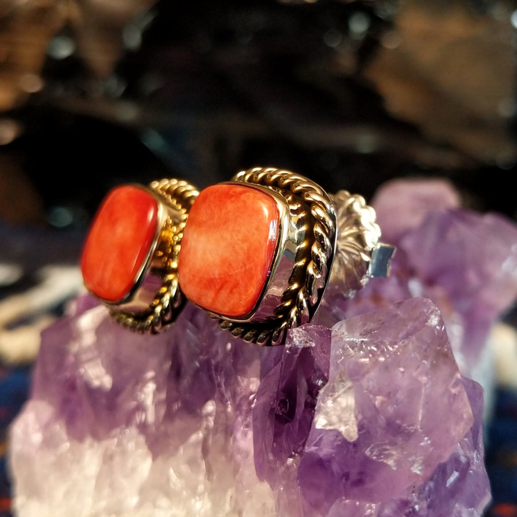 Square red spiny oyster shell earrings with twisted rope silver and gold borders.