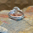 Sterling silver ring with lapis set in the round bezel, framed by twisted rope and dotted accents on the band.
