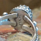 Close-up of the artisan's stamped signature.
