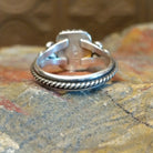 Sterling silver ring with lapis set in the square bezel, framed by twisted rope and dotted accents.