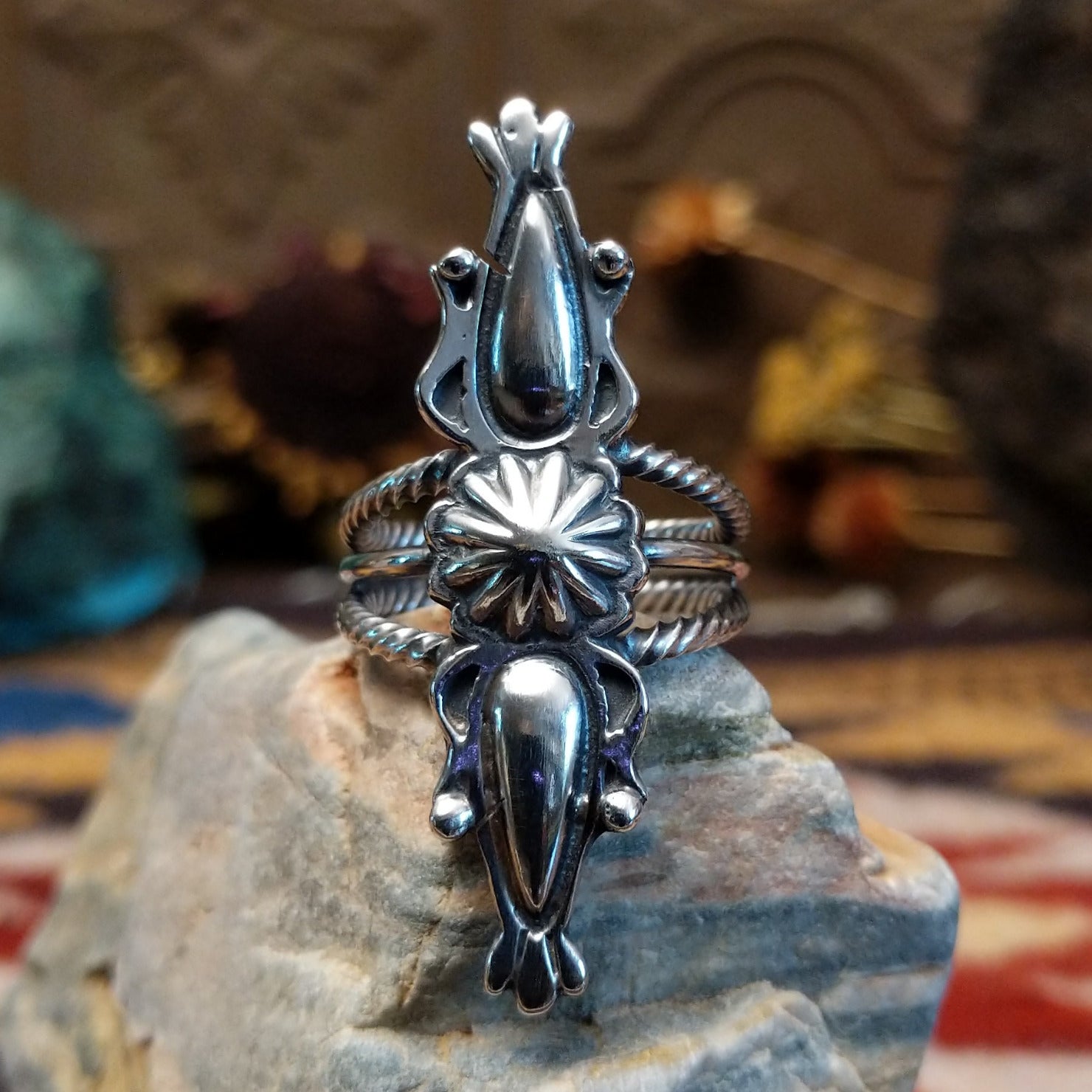 Handcrafted Navajo sterling silver ring featuring intricate silver detailing and traditional Southwestern craftsmanship in a bold regal design.