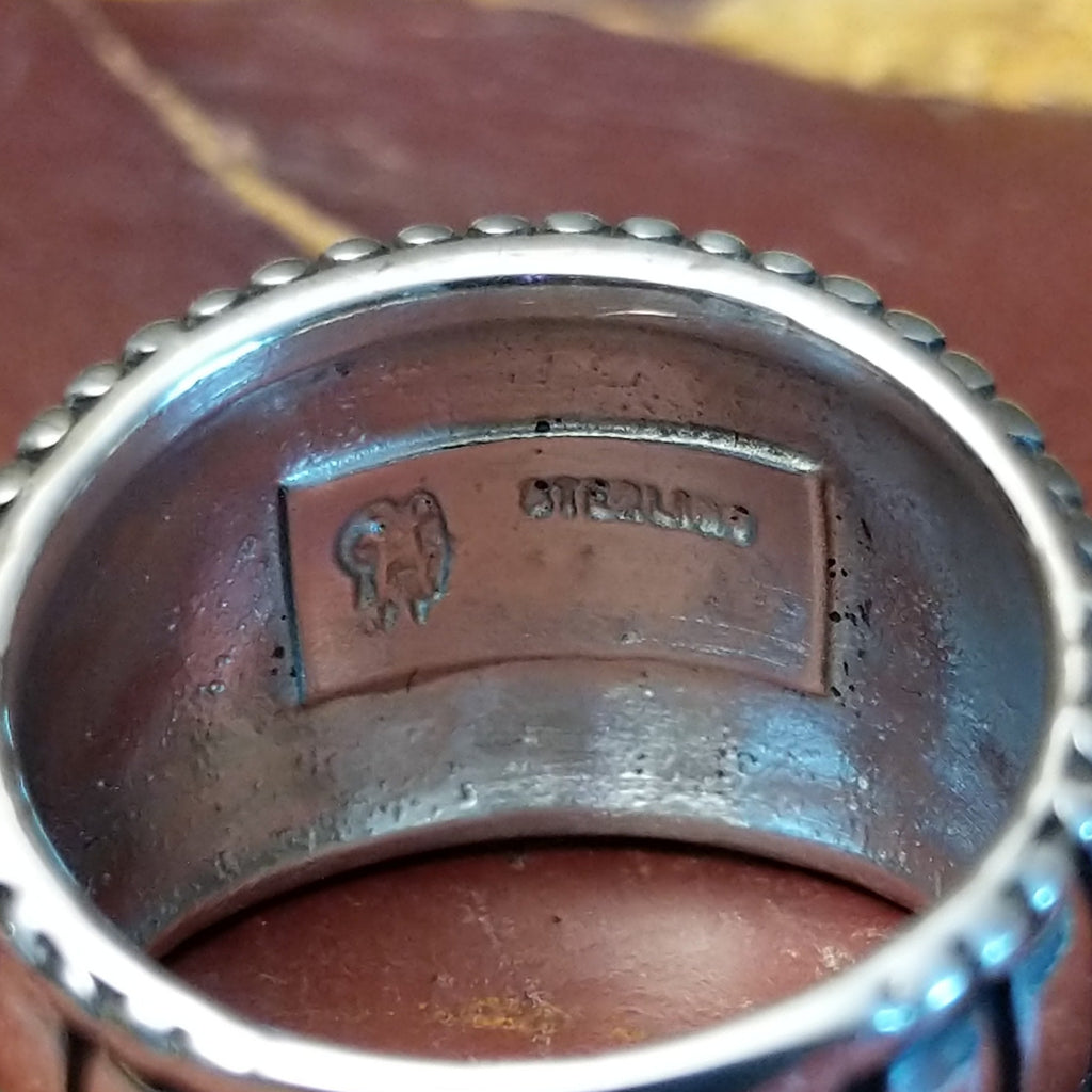 A close-up of the stamp on the interior of the ring.