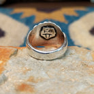 Handcrafted sterling silver Navajo ridged ring, featuring a polished domed design with bold vertical ridges; underside view.