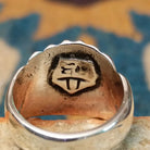Handcrafted sterling silver Navajo ridged ring, featuring a polished domed design with bold vertical ridges; artisan stamp.