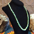 Rough cut Sonoran Gold turquoise beaded along the sterling silver chain of the necklace.