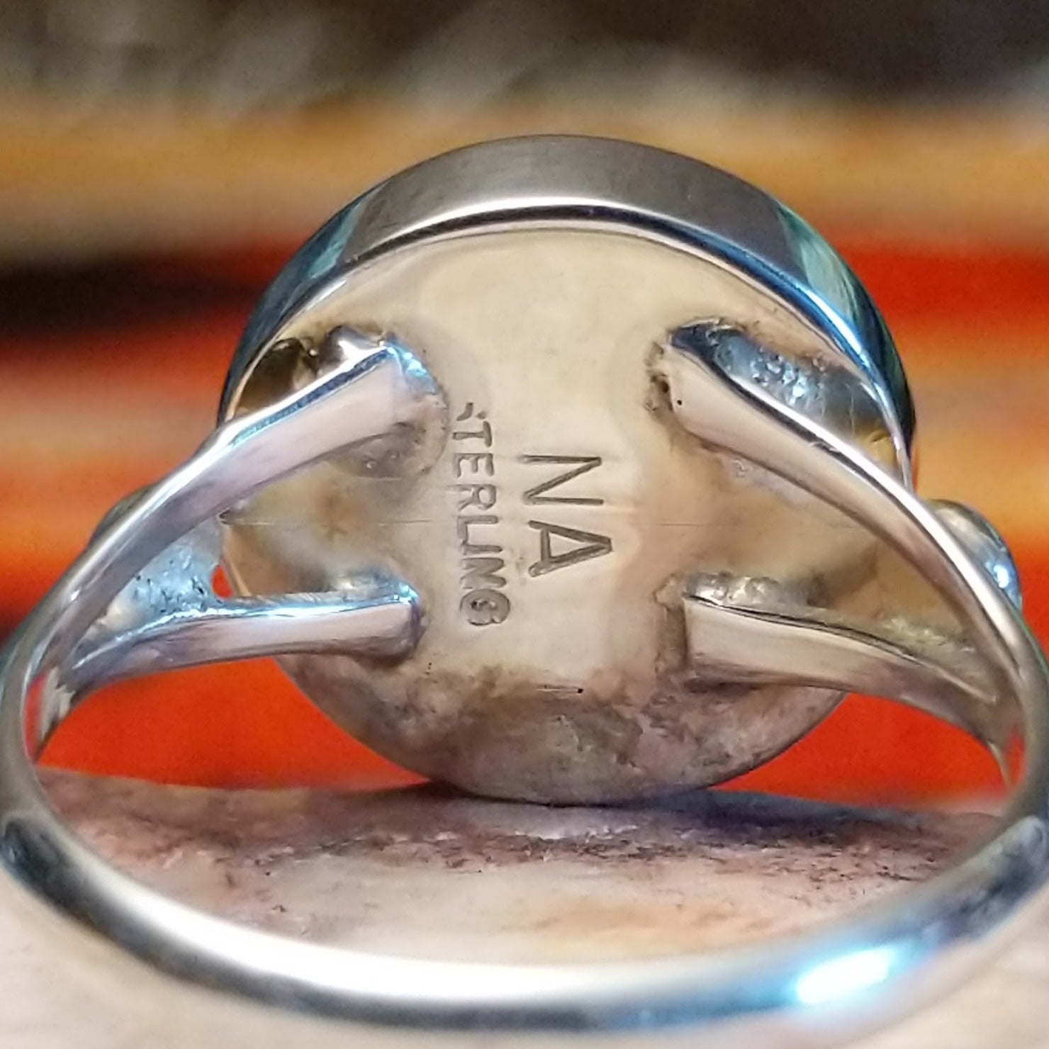 Close-up of the artisan's stamped signature.
